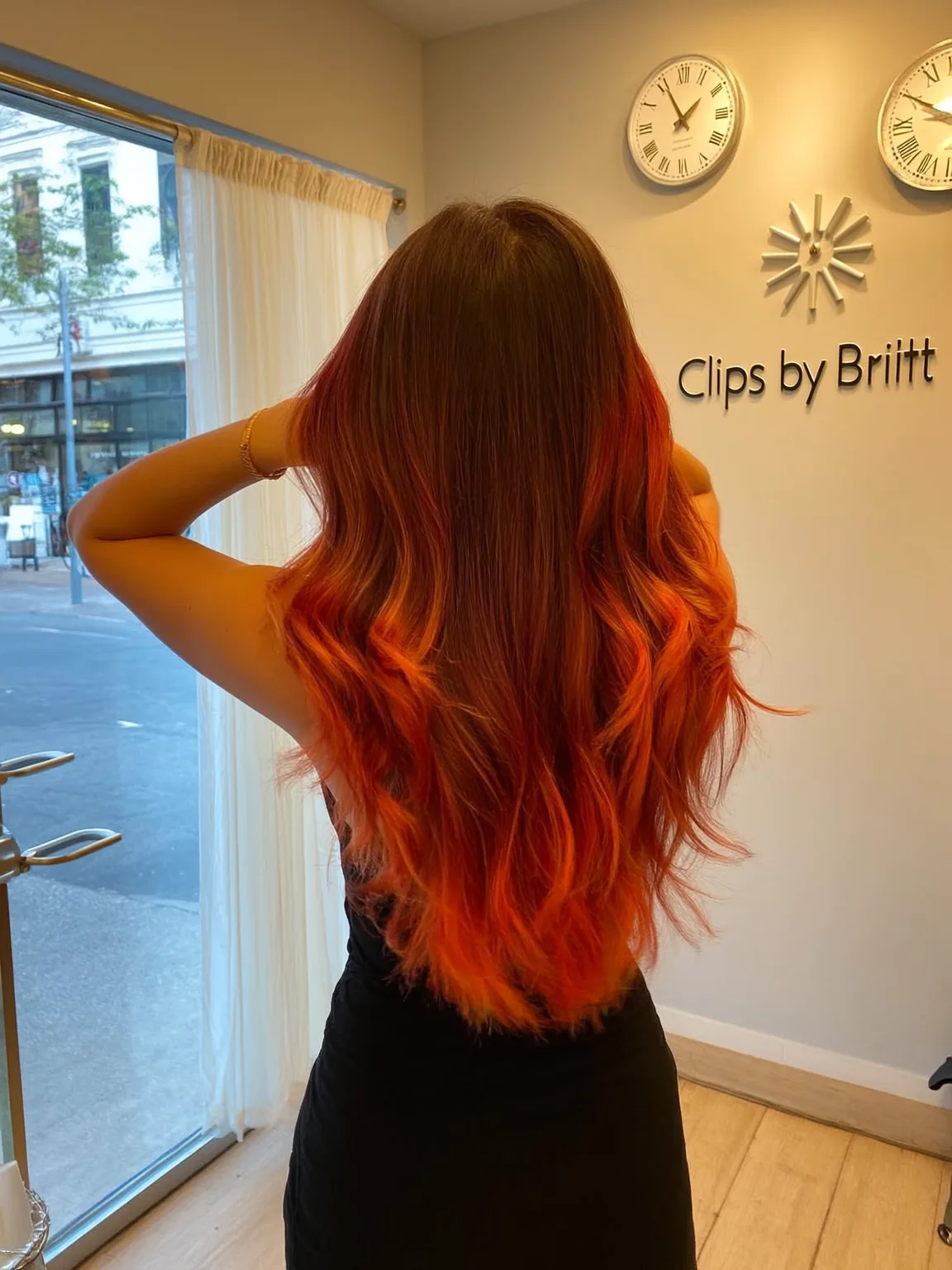 Long Vibrant Red Layered Waves with Fiery Orange Balayage